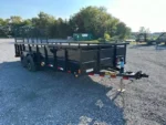 Big Tex 7 x 20 landscape utility trailer with solid steel sides and rear ramp gate for sale at TrailerWorld