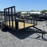 Carry On 7 x 14 landscape utility trailer with mesh sides and ATV gate
