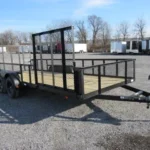 Carry On 7 x 18 landscape utility trailer with mesh sides and side ATV gate for sale at TrailerWorld