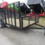 Premier 6 x 14 landscape utility trailer with mesh sides, side ATV ramp and rear ramp gate for sale at TrailerWorld