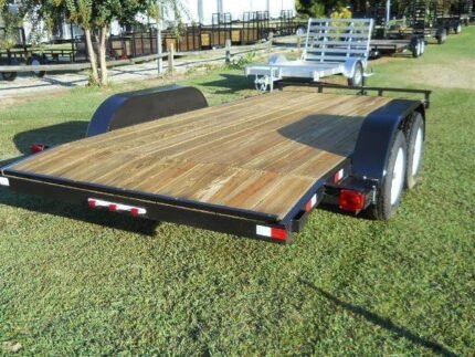 2026 American CH16W 16 foot wood deck equipment trailer with removable drive-over fenders, slide-in ramps and 7000 lb GVWR for sale at TrailerWorld