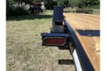 2026 American CH20W 20 foot wood deck equipment trailer with removable fenders, 4 foot beavertail and slide-in ramps for sale at TrailerWorld